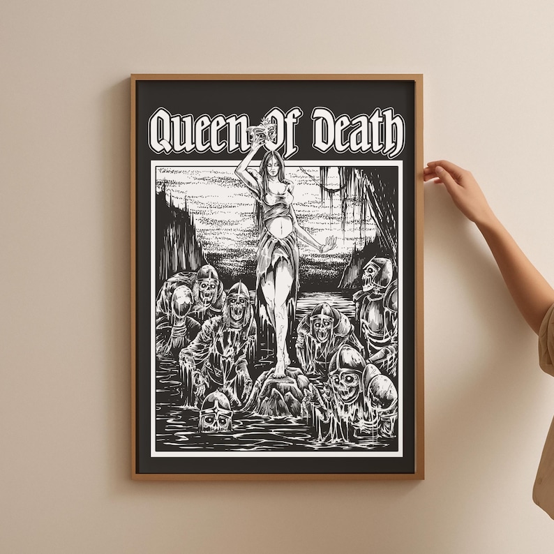 May include: Black and white framed art print featuring the text "Queen of Death." The artwork depicts a woman standing on a rock surrounded by skeletal figures in a dark, swampy environment. The print has a vintage, gothic aesthetic.