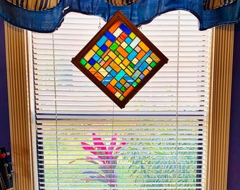 Handcrafted Stained Glass Mosaic Panel mounted in a custom Red Oak Frame