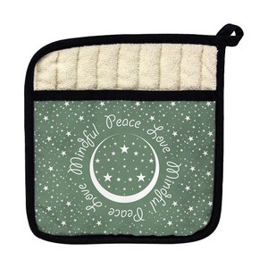 May include: Green pot holder with a white crescent moon and stars design. The text "Peace Love Mindful" is written around the moon in a circle.