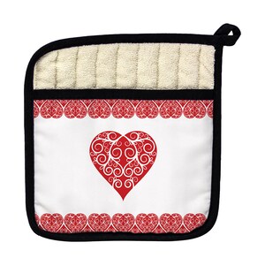 May include: Red heart with white swirls on a white background with a red and white heart border. The pot holder is beige on the back and has a black border.