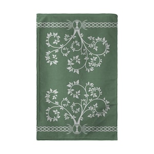 May include: Green cotton kitchen towel with a white design of two stylized trees with triple moon symbols at the base and a Celtic knot border.