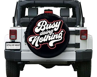 Busy doing nothing funny spare tire cover available with or without camera cutout