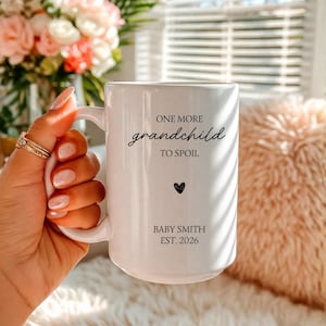 May include: A set of three ceramic mugs with a speckled, matte finish. The mugs are in shades of cream, light gray, and dark gray. Each mug has a simple, minimalist design, perfect for coffee or tea.