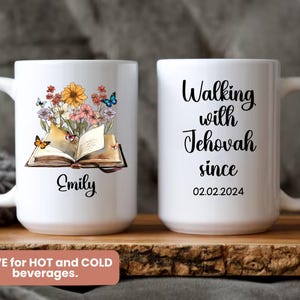 May include: White ceramic mug with a floral and butterfly design, an open book, and the name "Emily." The other side reads "Walking with Jehovah since 02.02.2024."