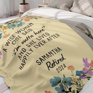 May include: A yellow floral throw blanket with the text "A wise woman once said 'I'm outta here' and she lived happily ever after Samantha Retired 2024".