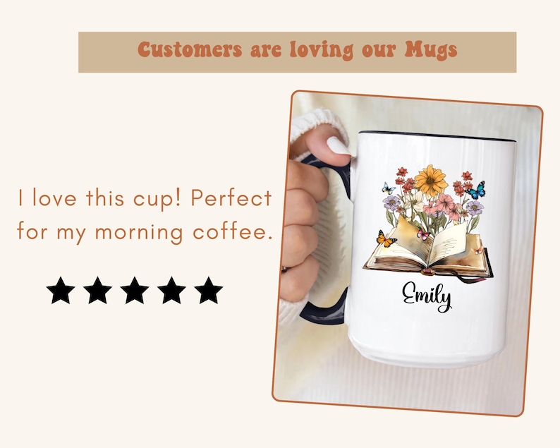 May include: White ceramic mug with a black rim, featuring a floral and butterfly design over an open book. The name "Emily" is written in cursive. Text at the top reads "Customers are loving our Mugs."