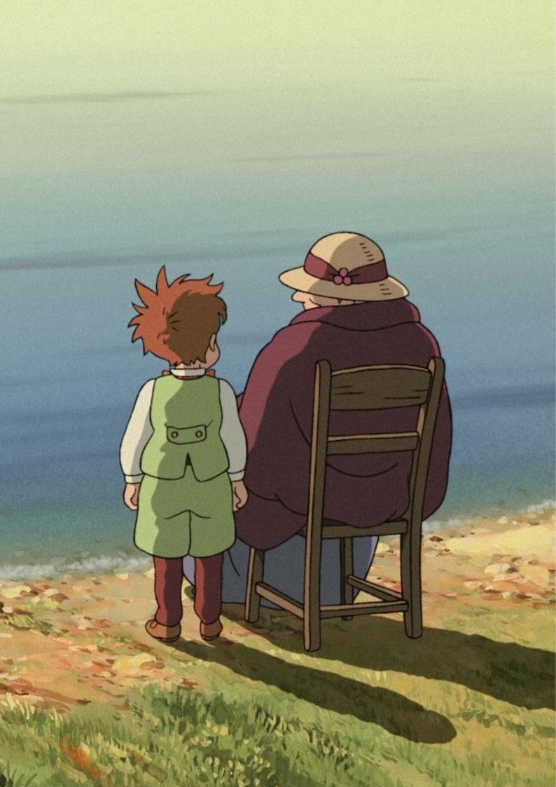 May include: An animated scene depicts a child and an older person by the sea. The child, in a green vest and shorts, stands facing the water. The older person, wearing a hat and a maroon shawl, sits on a wooden chair. The scene is set on a grassy shore.