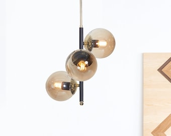 Modern Chandelier with Honey Amber Glass Globes - Black and Gold Metal Finish - Mid-Century Inspired Ceiling Light Fixture for Stylish Homes