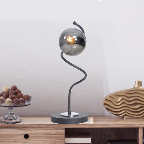 Sleek Black and Chrome Desk Lamp with Smoked Glass Globe, Modern Curved Metal Table Light, Unique Home Office Decor Accessory