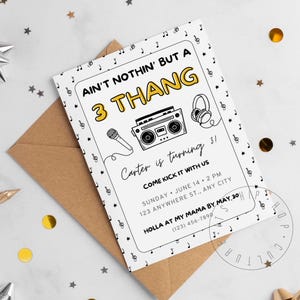May include: A white birthday invitation with black and yellow text. The invitation says "Ain't nothin' but a 3 Thang" with a cartoon boombox and headphones. The invitation is for Carter's 3rd birthday party. The party is on Sunday, June 14th at 2 PM at 123 Anywhere St. RSVP by May 30th.