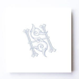 May include: A light blue, ornate monogram design featuring the letters "S" and "H" intertwined. The design includes floral and scroll elements, set against a white background. The artwork is centered on a square card.