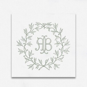 May include: A green leafy wreath with a monogram of the letters "AB" in the center.