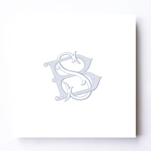 May include: A light gray monogram featuring the intertwined letters "B" and "S" in an elegant, ornate script. The design is centered on a white square, creating a classic and sophisticated aesthetic. The letters have a decorative, vintage style.
