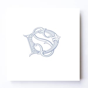 May include: A square white card featuring a centered, ornate, light blue monogram of the letters S and D intertwined. The design uses elegant, flowing calligraphic lines with decorative flourishes and leaf-like accents on a clean, solid background.