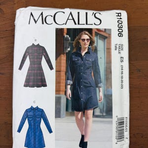May include: McCall's sewing pattern R10306 for a button-down dress. The pattern includes illustrations of the dress in denim and plaid fabrics. The size range is E5 (14-16-18-20-22).