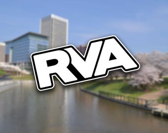 May include: A white graphic with the text "RVA" in bold black letters against a blurred background of a city skyline and a river.