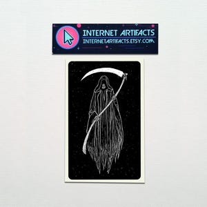 May include: Black and white illustration of Death, a skeletal figure in a hooded robe, holding a scythe. The background is black with white stars.