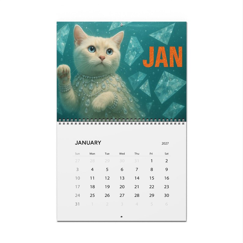 May include: A wall calendar for January 2027 featuring a white cat wearing a diamond-style necklace and bracelet against a teal background with floating diamond shapes and the orange text JAN. The calendar grid shows the days of the month.