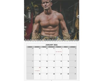 May include: A wall calendar for January 2026 featuring a muscular man. The calendar has a white background with a spiral binding at the top. The man is shirtless and wearing work gloves. The calendar grid is visible.