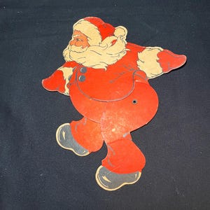 Vintage gestanste kartonnen kerstman met bewegende poten