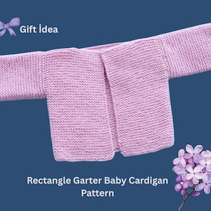 May include: A pink knitted baby cardigan with a rectangle shape and a garter stitch pattern. The cardigan is open at the front and has long sleeves. The text "Gift idea" and "Rectangle Garter Baby Cardigan Pattern" is visible in the image.