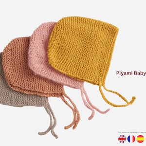May include: Four knitted baby bonnets in shades of gray, brown, pink, and yellow. Each bonnet has a square shape with ties. The text "Piyami Baby Bonnet" is displayed in the image.