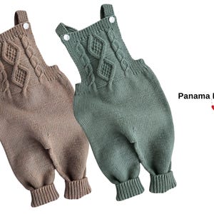 May include: Two knitted baby rompers in the image, one in a muted brown and the other in a soft green. Both feature a cable knit design on the chest and straps with button closures. The text "Panama Romper" is visible.