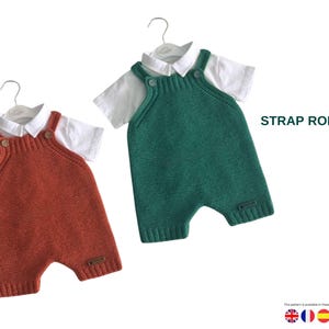 Puede incluir: Dos peleles de tirantes de punto, uno en óxido y otro en verde azulado, cada uno combinado con una camisa blanca con cuello. Se muestra el texto "STRAP ROMPER". Los peleles se muestran en perchas.