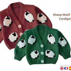 May include: Two knitted crop cardigans, one in a deep red and the other in green, each adorned with white sheep motifs. The cardigans have button closures and are labeled "Sheep Motif Crop Cardigan".