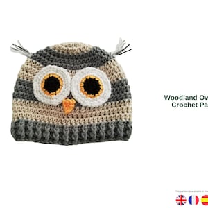 May include: A handmade crochet owl hat in shades of gray, beige, and black. The hat features large, round eyes with white, yellow, and black details, and a small orange beak. The text "Woodland Owl Hat - Crochet Pattern" is visible.