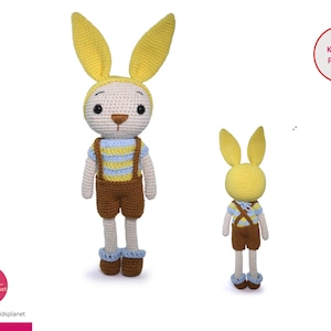 May include: A crocheted bunny rabbit toy wearing a yellow and blue striped shirt and brown overalls. The bunny has yellow ears and a white face. The toy is standing on a white background. Knitting Pattern.