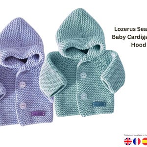 Puede incluir: Dos cárdigans de bebé tejidos con capucha. Uno es lila claro, el otro es verde suave. Cada uno tiene cierre de botón y una pequeña etiqueta. El texto dice: "Lozerus Seamless Baby Cardigan with Hood."