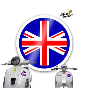 May include: A white scooter with a Union Jack sticker. A large round sticker with the Union Jack design is in the background. The Mia Buzz logo is visible.
