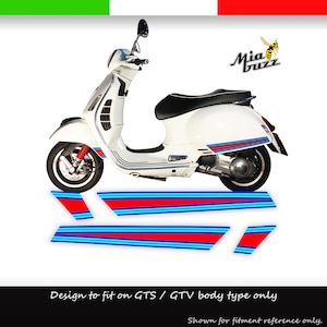 May include: White scooter with red and blue racing stripes. The scooter has a black seat and red suspension. The image includes additional stripe decals. Text on the image reads "Mia Buzz" and "Design to fit on GTS / GTV body type only."