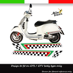 May include: White scooter with black seat and red suspension. The scooter has a checkered flag design with green and red accents. The text "Mia Buzz" is visible. The text "Design to fit on GTS / GTV body type only" is also visible.