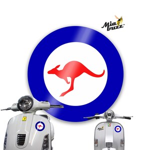 May include: A white scooter with a round sticker featuring a red kangaroo inside a white circle, surrounded by a blue ring. The sticker is also on the scooter's front. The Mia Buzz logo is in the top right corner.
