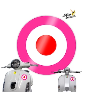 May include: White scooters with a pink and red target design. The scooters have a round target sticker on the front. A large pink and red target graphic is in the background. The Mia Buzz logo is in the upper right corner.