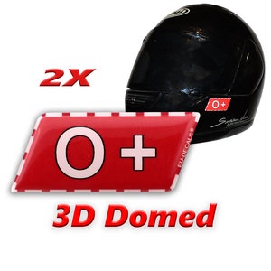 May include: Two 3D domed stickers with a red background and white border. The stickers say "O+" in white letters. The stickers are shown on a black motorcycle helmet.