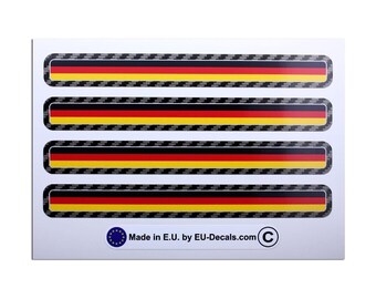 May include: A sheet of four rectangular stickers featuring the German flag's colors: black, red, and yellow. Each sticker has a carbon fiber-style border. The text "Made in E.U. by EU-Decals.com" is printed at the bottom.