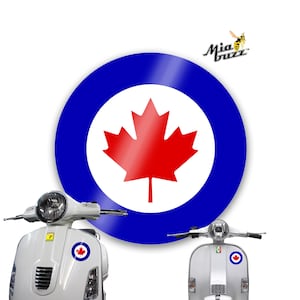 May include: White scooter with a round sticker featuring a red maple leaf on a white background, surrounded by a blue ring. The scooter has a headlight and a small sticker with a maple leaf.