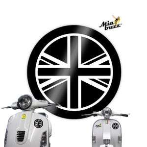 May include: A white scooter featuring a black and white Union Jack design. The scooter has a round headlight and a small Union Jack emblem. A large black and white Union Jack design is also present in the image, along with a Mia Buzz logo.