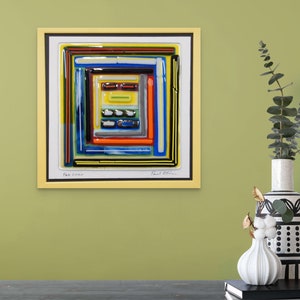 May include: A framed abstract art piece with a yellow frame. The artwork features a colorful, geometric design with layers of blue, yellow, orange, and black lines. The text "Feb 2020" and a signature are visible.