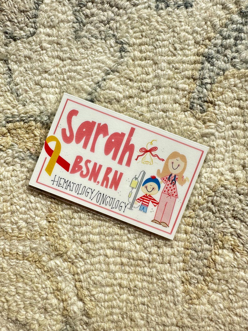 May include: A pink and white card with the name "Sarah BSN, RN" and the words "Hematology/Oncology". The card features a cartoon illustration of a woman with a stethoscope and a child with an IV drip.