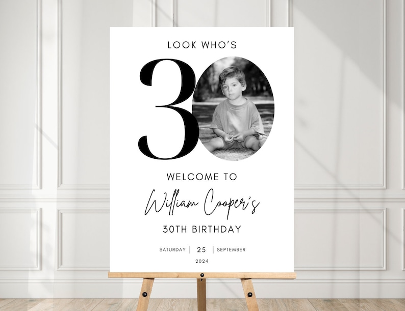 May include: Black and white welcome sign with the text "Look Who's 30" in large bold font. The sign also includes a photo of a young boy, the text "Welcome to William Cooper's 30th Birthday", and the date "Saturday 25 September 2024".