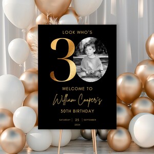 May include: Black and gold 30th birthday party sign with the text "Look Who's 30", "Welcome to William Cooper's 30th Birthday", "Saturday 25 September 202X". A black and white photo of a young boy is in the center of the number 30.