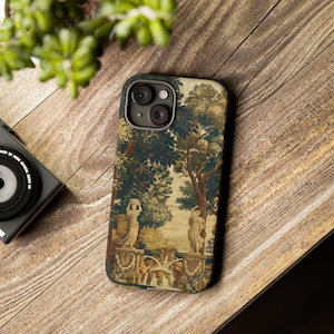 May include: A smartphone case featuring a printed tapestry design of a classical garden scene with two stone statues, a central fountain, and lush green trees. The artwork displays muted earth tones, including shades of beige, brown, and dark green.