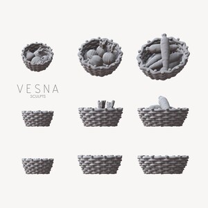 May include: A set of nine gray wicker baskets, some filled with vegetables, including carrots and onions. The baskets are arranged in a grid pattern on a white background. The text "VESNA SCULPTS" is displayed below the baskets.