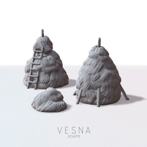 May include: Three gray 3D printed hay bale models. One hay bale has a ladder attached to it. The hay bales are on a white surface. The text "VESNA SCULPTS" is at the bottom of the image.