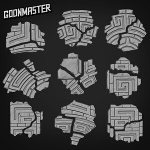 May include: Nine gray stone tiles with a geometric pattern, broken into pieces. The tiles are arranged in three rows of three.