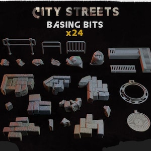 May include: A set of 24 grey plastic city street basing bits for model building. The set includes various shapes and sizes of street pieces, including fences, grates, and manhole covers.